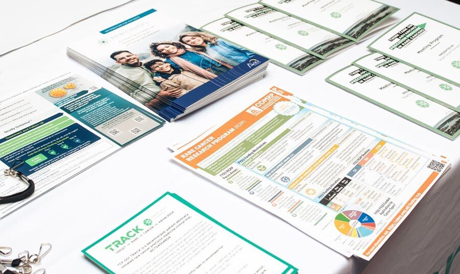 Learning materials for rare cancers arranged on a table