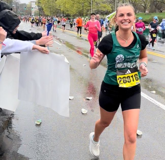 Caitlin Panciocco running in the Boston Marathon with Team TCF